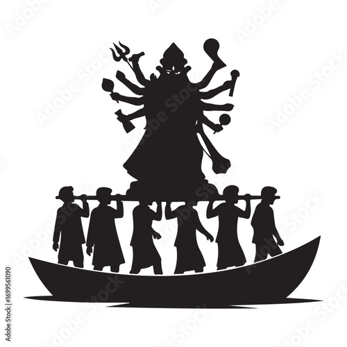 Silhouette of a hindu goddess durga idol being carried on a boat by devotees