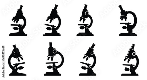 microscopes arranged in grid pattern with hand adjusting one