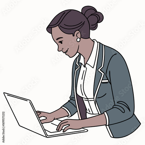 Smiling businesswoman wearing a suit and blouse working on a laptop computer with her hair in a bun