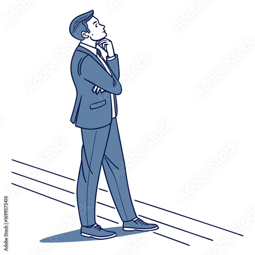 Thoughtful businessman in a suit standing with arms crossed looking up and contemplating a decision