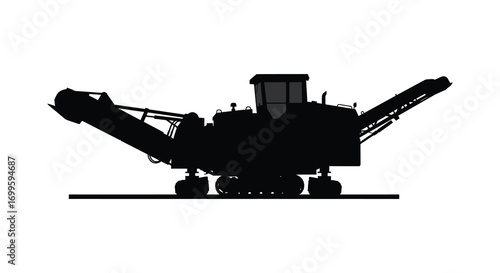 a large industrial machine with conveyor belt and wheels