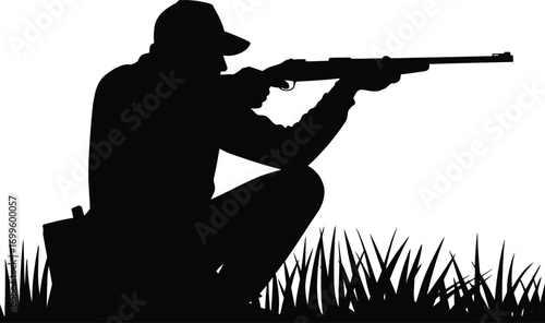 Silhouette of a hunter aiming a rifle in an outdoor setting