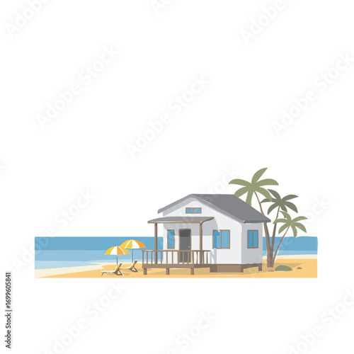 A charming beach house with palm trees and lounge chairs sits on a sandy shore next to the ocean.