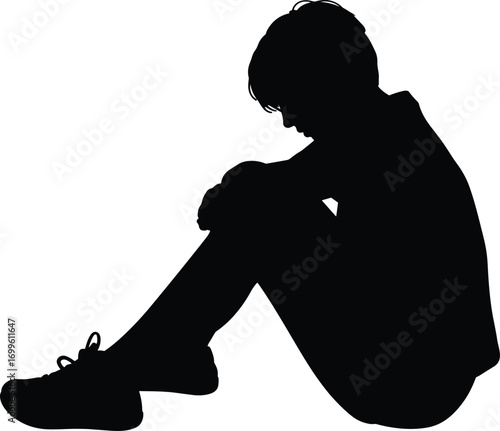 Silhouette of sad person sitting on ground, head down, emotional pose, concept of depression, loneliness, anxiety, mental health awareness