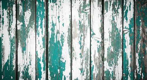 Rustic weathered wooden fence with peeling green and white paint