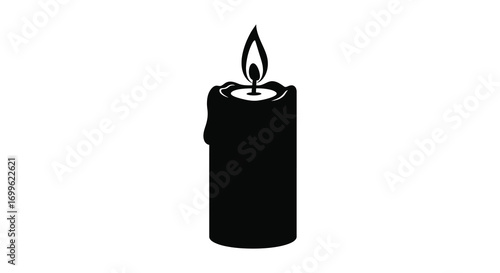 a single black candle with a bright flame glowing