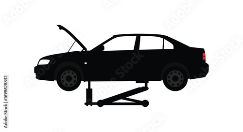 a car silhouette raised on jack with open hood