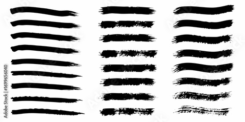Collection of black ink brush strokes and paint splatters on a white background