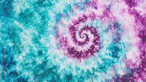 Tie dye fabric teal purple spiral pattern texture background
