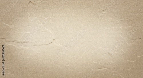 Warm beige stone wall background with a rough, uneven texture and subtle cracks, illuminated by a central spotlight creating a soft vignette effect