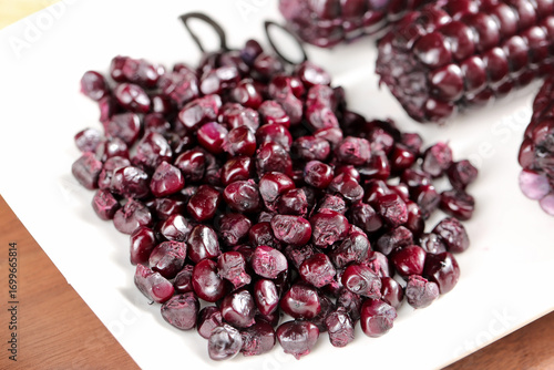 Purple Glutinous Corn Kernels from Yunnan China on White Plates - Traditional Asian Grain Food Ingredient