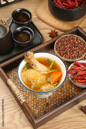 Traditional Chinese Herbal Chicken Soup with Dried Ingredients and Spices on Bamboo Tray - Zhaoqing Health Food