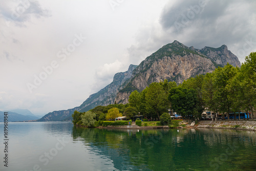 Lecco, Italy - May 15, 2024: Como Lake and town of Lecco waterfront, Lombardy region of Italy