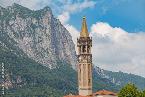 Bell tower of basilica of Saint Nicholas (Campanile di San Nicolo) dominating the view in Lecco, Italy. St. Nicholas is Lecco's patron saint.