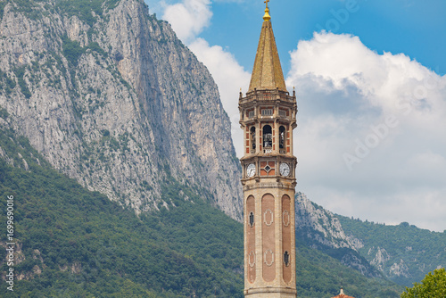 Bell tower of basilica of Saint Nicholas (Campanile di San Nicolo) dominating the view in Lecco, Italy. St. Nicholas is Lecco's patron saint.