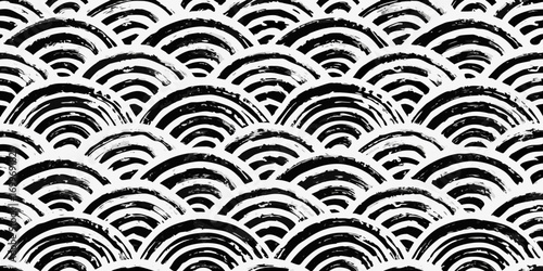 Abstract black and white brush stroke pattern resembling overlapping scales or waves