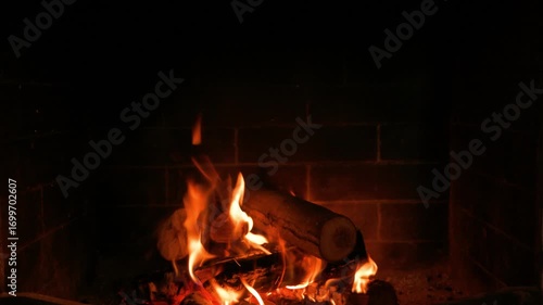 Home fireplace with red flame. 4K video relaxing endless footage 