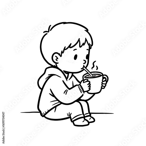 Young boy sipping warm drink while sitting on floor at home  