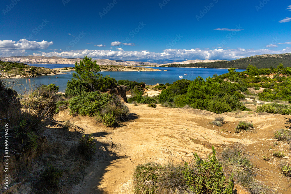 Fototapeta premium Sand dunes, rock formations, and a trail leading to the FKK Ciganka naturist beach on the island of Rab