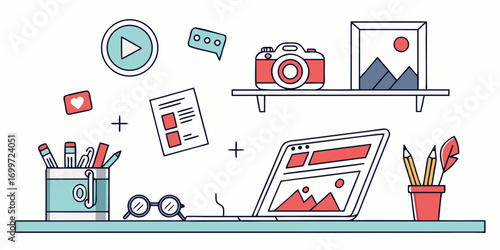 Creative workspace with laptop, camera, and art supplies