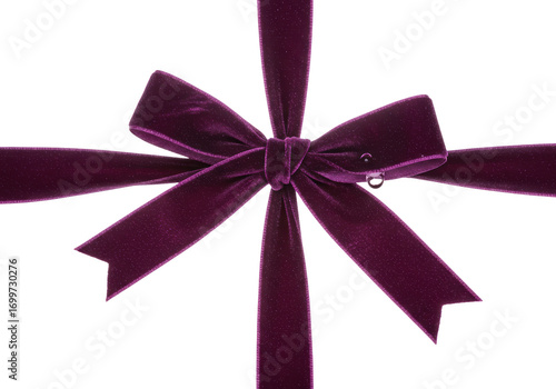 Isolated luxurious dark purple velvet bow for gift boxes and holiday celebrations
