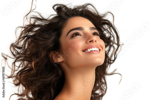 Radiant Young Woman with Curly Hair Smiling Joyfully Against a Soft Background, Celebrating Happiness and Positivity in Beauty and Confidence
