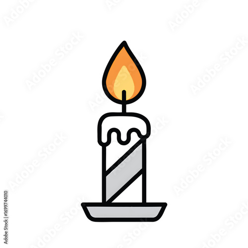 A lit grey and white striped candle sits on a small plate.