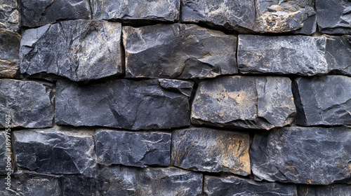 Obraz na płótnie Dark gray stone wall texture rough surface natural building material