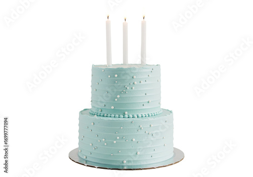 Isolated tiered teal frosted cake with candles for a birthday celebration or special occasion