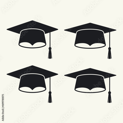 Four black graduation caps arranged in a grid on a light background