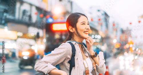 Bilde på lerret Asian woman traveler backpack solo travel in city chinatown street food market t