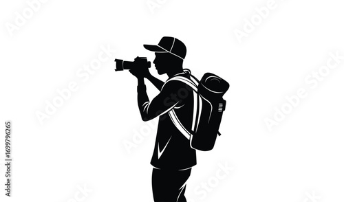 Silhouette of a photographer with a backpack taking a photo