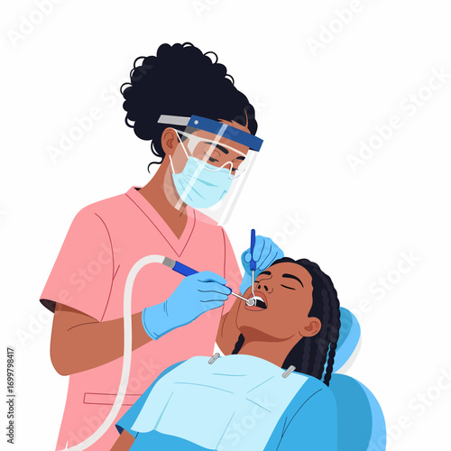 A female dentist wearing a face mask and shield performs a dental procedure on a patient sitting in a chair.