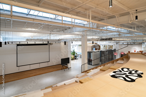Fototapeta Naklejka Na Ścianę i Meble -  Modern office space with projection screen and tiered seating