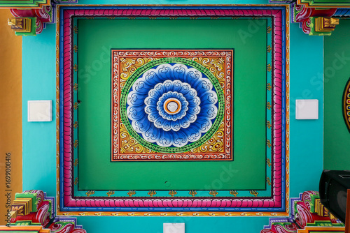 Colorful flower pattern ceiling design in Hindu temple