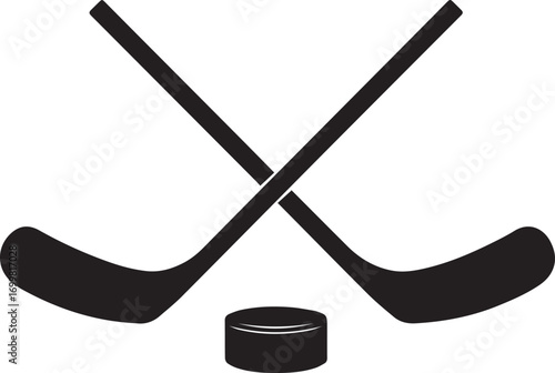 Two crossed hockey sticks and puck silhouette