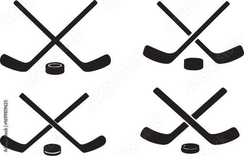 Four hockey sticks and pucks crossed silhouette