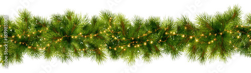 Festive garland made of lush green pine branches adorned with twinkling lights, perfect for holiday decorations and creating warm, inviting atmosphere