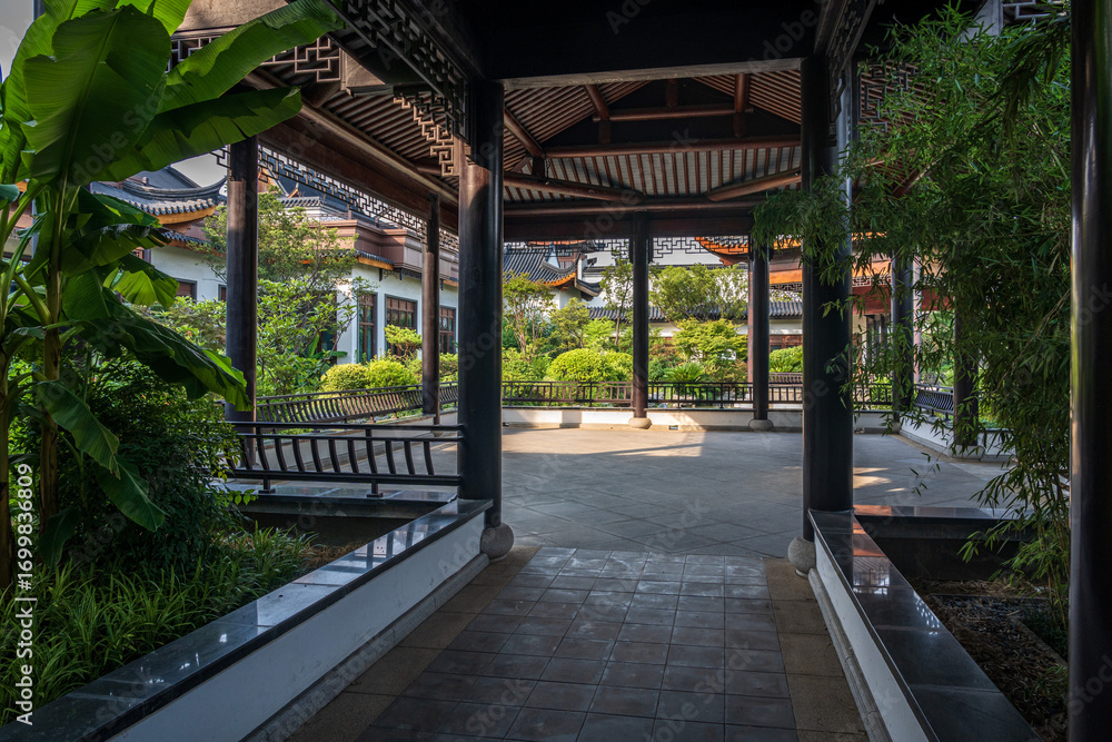 Naklejka premium Tranquil Pathway Through a Lush Zen Garden Embraced by Nature