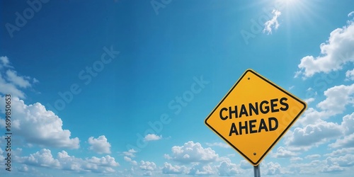 Yellow road sign reading 'Changes Ahead' under a bright blue sky with scattered white clouds, symbolizing transition and new beginnings.