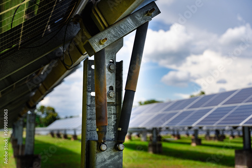 Heavy-duty galvanized steel mounting structure with hydraulic support rods for solar panels, providing stable ground installation and durability in large-scale solar power systems.