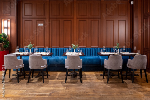 Elegant Restaurant Interior with Booth Seating and Wood Paneling.
