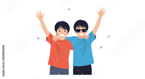 Two happy young boys with arms raised in celebration and friendship standing together in a cheerful pose
