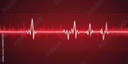 An EKG graph on a monitor shows the rhythmic cardiogram of a red heartbeat