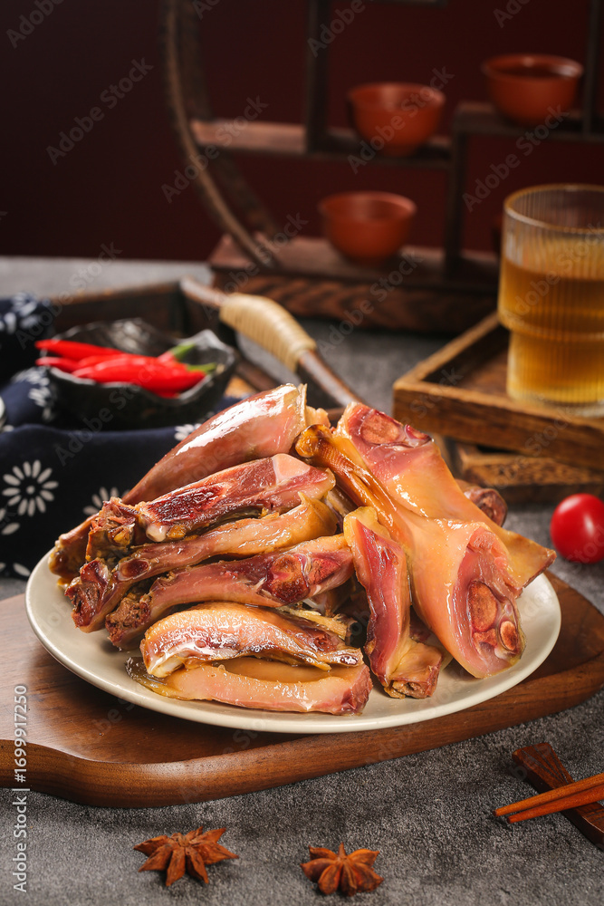 Air-dried whole duck meat with spices on rustic farmhouse wooden serving board traditional cuisine Air-dried whole duck meat with spices on rustic farmhouse wooden serving board traditional cuisine