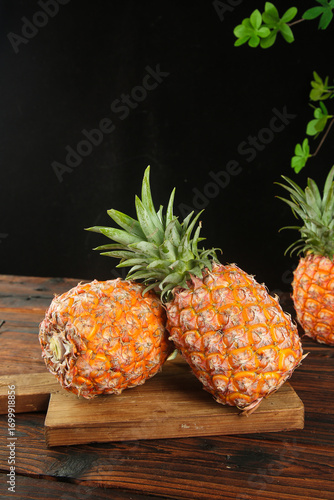 Fresh Golden Hainan Pineapples on Wooden Board - Tropical Fruit Display