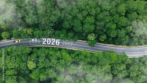 Aerial top view road in forest with car to start the new year 2026 Goal plan action, Business target and growth strategy. Business annual plan and development for achieving goals and success.