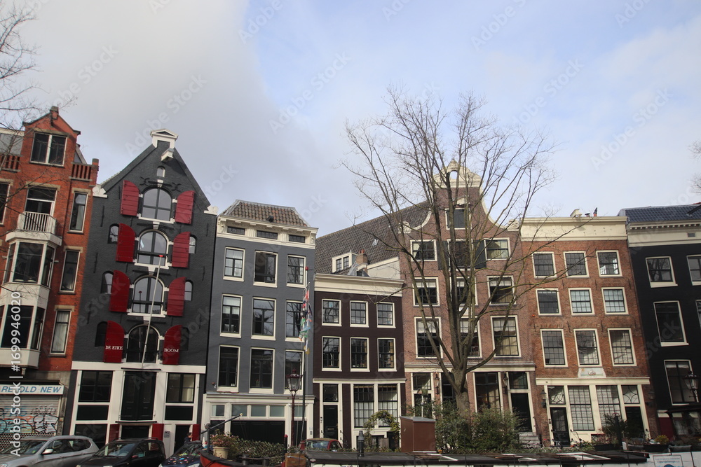 Obraz premium Amsterdam canal houses Facades of historical buildings in Amsterdam canal district