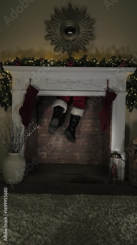 4K: Father Christmas stuck in the chimney on Christmas Eve. Santa Claus legs are dangling. Vertical. Stock Video Clip Footage