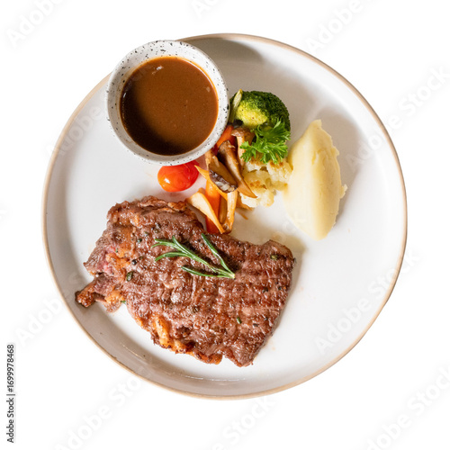 Fotografía Gourmet Steak Delight: An overhead shot of a perfectly grilled steak, plated wit